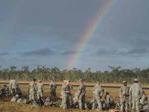 Members of the 4-25th Airborne Brigade congregate under a rainbow during exercise Talisman Saber. Photo: Zachariah Hughes/KSKA.