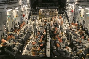 Troops load up inside the belly of a C-17. Photo: Zachariah Hughes/KSKA.