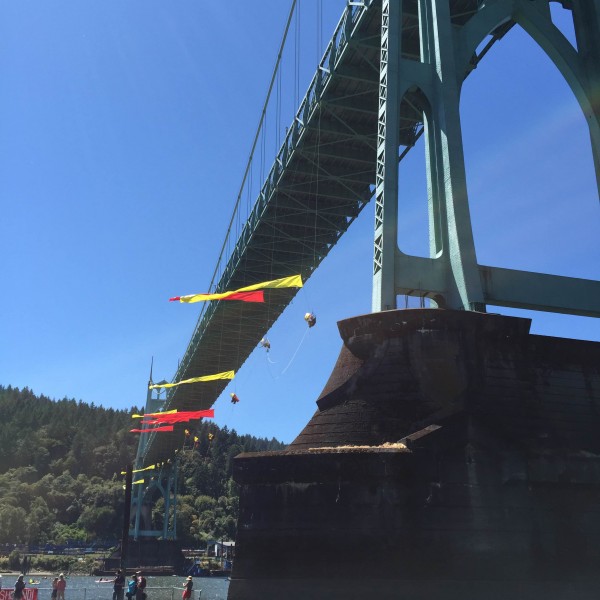Thirteen Greenpeace protesters are suspended from the St. John's Bridge over the Willamette River in an attempt to impede Shell's icebreaker vessel from returning north. Photo: Liz Arnold, shared with permission.