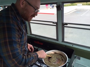 Austin Schwartz roasts coffee in the back of his vintage bus. Hillman/KSKA