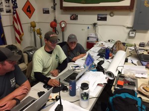  Sam Amato (middle) and Risa Lange-Navarro (right) at work in the Galena Command Post for the Northern Rockies Fire Management Team.