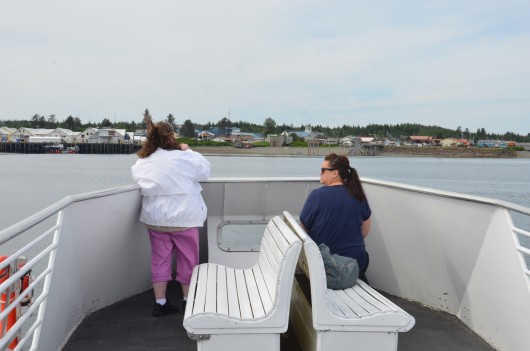 Tourists take pictures aboard an Allen Marine tour approaching Metlakatla on July 1, 2015. Photo by Ruth Eddy/KRBD.