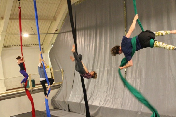 Some students come to circus with prior training in dance, yoga, or climbing. But many are new to the aerial arts. (Emily Kwong/KCAW photo)