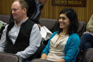 Israa Kako-Gehring beams after the Assembly adopts an ordinance relaxing land-use restrictions on childcare homes and centers, Aug. 10, 2015. (Photo by Jeremy Hsieh/KTOO)