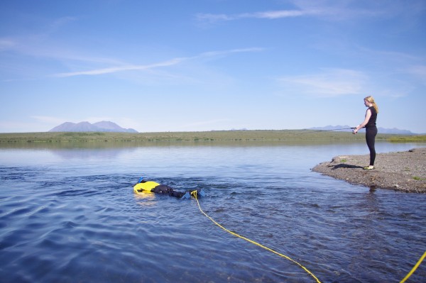 Soldotna High freshman Drew Wassily snorkels in Pungokepuk Lake while Dillingham senior Savanna Sage casts with a spinning rod on August 5, 2015. Fish were a highlight of the four-day float from the lake to the Togiak River.