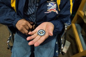 At the listening session in Kotzebue, McDonald gave veterans a coin with his seal and signature. Photo: Mitch Borden, KNOM