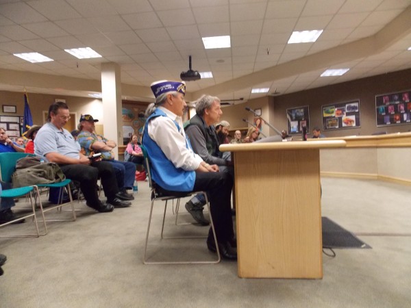 Alaska Native Veteran's Association President Benno Cleveland (foreground) speaks at VA listening session. Credit Dan Bross / KUAC