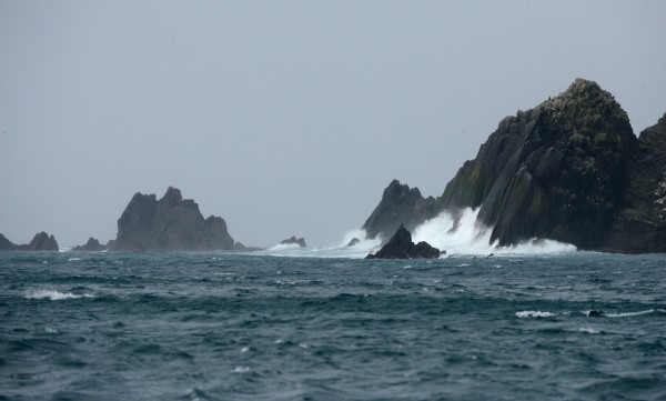 Waves break against rocks near Buldir Island as researchers and supplies are ferried from the US Fish and Wildlife Service research boat R/V Tiglax to Buldir Island in the Aleutians during a trip from Adak Island to Attu Island on a weeklong research mission in southwestern Alaska, on Tuesday, June 2, 2015. Scientists on the R/V Tiglax conduct research in the Alaska Maritime National Wildlife Refuge. (Bob Hallinen / Alaska Dispatch News)