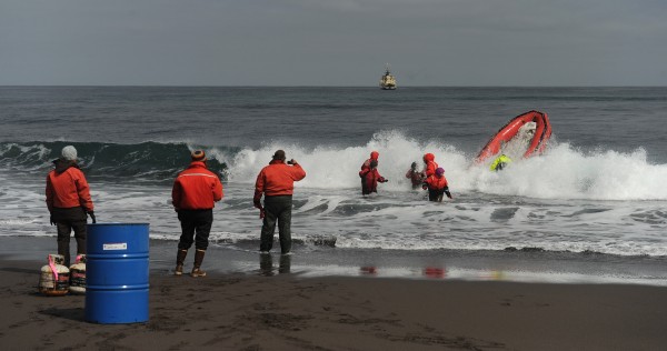 A skiff takes a wave over the bow as it returns for another load of supplies are moved to a research camp on Buldir Island as the US Fish and Wildlife Service research boat R/V Tiglax is on a weeklong voyage in the Aleutian Islands on Friday, June 5, 2015. The researchers and their supplies were dropped off earlier in the week and they hauled some the there supplies to the camp across the rocky beach. When seas moderated the Tiglax returned to transfer the rest of their supplies. 5 people were dropped off on the island including to research biologists from Memorial University of Newfoundland. Scientists on the R/V Tiglax conduct research in the Alaska Maritime National Wildlife Refuge. (Bob Hallinen / Alaska Dispatch News)