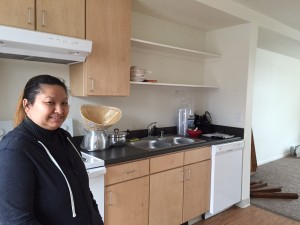 Mae Lee in her new apartment at Susitna Square. (Hillman/KSKA)