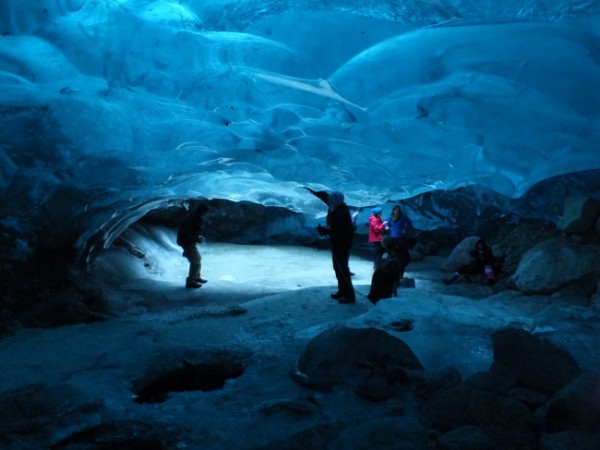 The Mendenhall Glacier ice cave in March 2014. This view shows daylight streaming in from the moulin. (Photo by Matt Miller/KTOO)
