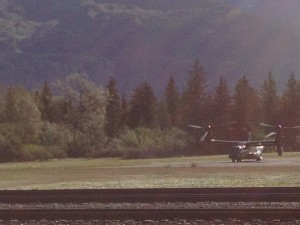 Choppers dance with the landing area ahead of the president's arrival. Photo: Ellen Lockyer/KSKA.