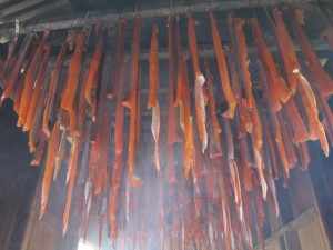 Silver salmon strips hang in Davidson's smokehouse. Photo Credit: Annie Feidt