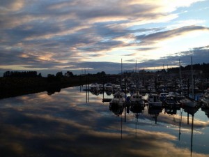A summer sunset colors the waters of Sitka’s Crescent Harbor in 2014. Municipal officials want to improve three harbors using a state grant program that may be at risk. (Shaleece Haas/KCAW)