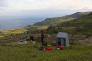 AVO seismologists work to repair a seismic station on Little Sitkin Volcano in the western Aleutians Islands. (USGS photo)