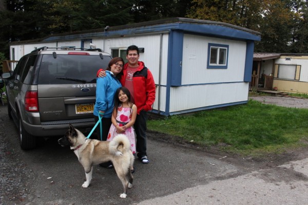 James Refuerzo and his family outside their home. (Photo by Elizabeth Jenkins/KTOO)