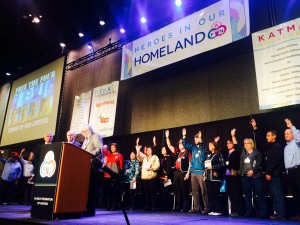 Raising an hand signing the number four became a symbol of solidarity at the 2015 AFN convention. Photo: Daysha Eaton/KBBI.