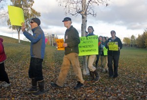 Opponents of the Northern Access Project rally outside of the Anchorage Assembly chambers at the Loussac Library. (Photo by Josh Edge, APRN - Anchorage)