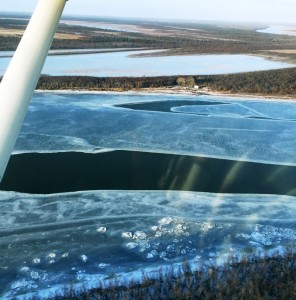 Two open holes in front of Wassilie B. Evan’s camp. There are 30 open holes in Kuskokwaq Slough alone. (Photo Courtesy of BSAR)