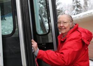 Vivian Cole boards the bus outside of the Daybreak center. (Hillman/KSKA)