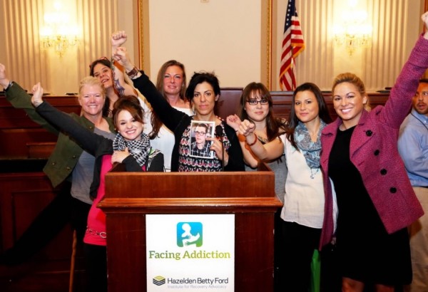 Alaskans were part of the UNITE to Face Addiction Rally in Washington, D.C.: (left to right) Kim Whitaker, Julee Douglas, Samantha Garton, Terria Walters, Kara Nelson, Delia Williams, Jennifer Mcallister and Christina Love inside a congressional office building in D.C. in October. Nelson is holding a picture of Christopher Seaman, the son of Walters who was murdered in Mat-Su in June. (Photo courtesy Kara Nelson)