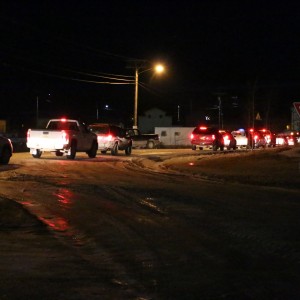 Cars line up outside the LKSD office, dropping off Ayaprun students as they return to school after four days without classes. Photo by Dean Swope / KYUK.