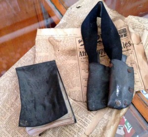 This leather bound notebook and knife holder were found under the floor of the men's bathroom upstairs during remodeling. Photo courtesy of Jill Williams.
