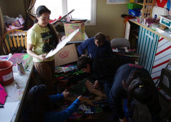 Anna Rae Petla, employee Gregg Marxmiller, and other teens organize the art room at Myspace. CREDIT MOLLY DISCHNER/KDLG