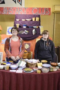 Phoenix Williams and Brianna Frisby help run the Juneau-Douglas High School art club booth at Public Market, which was located in the Juneau Arts & Culture Center. (Photo by Peter Metcalfe)