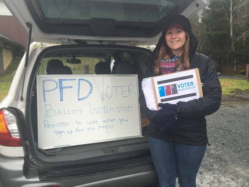 Zoe Kitchel canvassing for the PFD voter ballot initiative. (Photo by Emily Kwong)