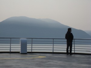 A passenger on the deck of an Alaska Marine Highway ferry. (Flickr Creative Commons – supafly)