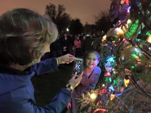 Sen. Murkowski snaps a photo of 10-year-old Anna DeVolld of Soldotna at the Capitol Christmas tree. Photo: Sen. Lisa Murkowski's Facebook page.