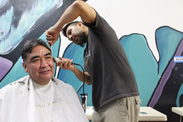 John Ross gets his hair cut by Marti Fred at Shear Design. (Photo by Elizabeth Jenkins/KTOO)