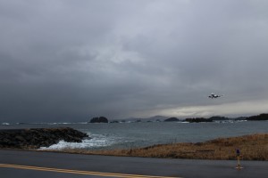 Sitka’s runway is encompassed by the Pacific Ocean. The tides bring in debris and some of that debris attracts birds, creating a natural buffet (Emily Kwong/KCAW photo)