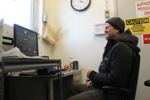 Patrick Boonstra, of Intelligent Energy Systems, in the control room of the Kwig power house. Photo: Rachel Waldholz/APRN