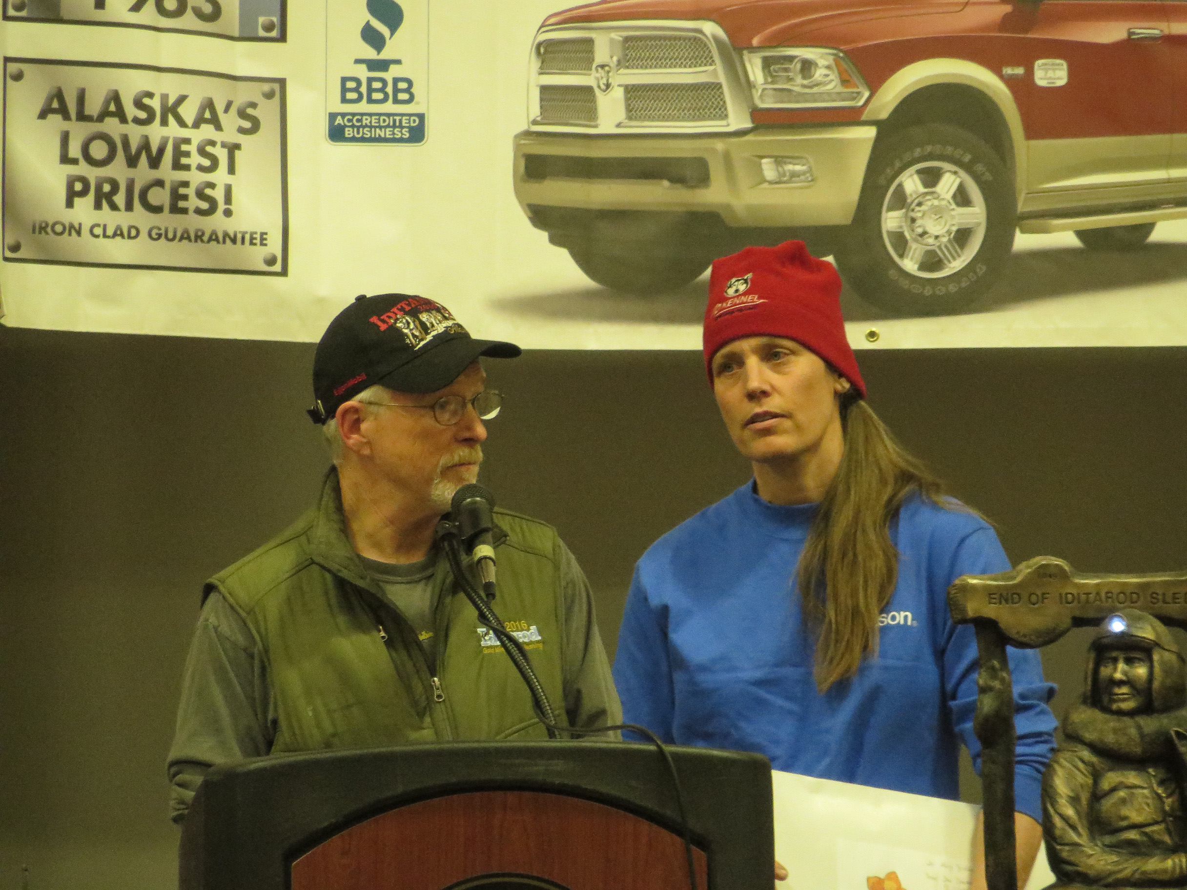 Jeff King and Aliy Zirkle thank the community of Nulato at the Iditarod Banquet Sunday night. The checkpoint village raised money for the mushers after a drunk snowmachiner struck their teams on the trail. (Photo by Laura Kraegel, KNOM - Nome)