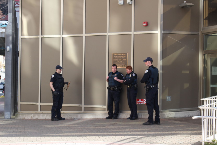 Juneau police outside the Dimond Courthouse, where a woman died from a gunshot wound in an apparent suicide. (Photo by Elizabeth Jenkins/KTOO)