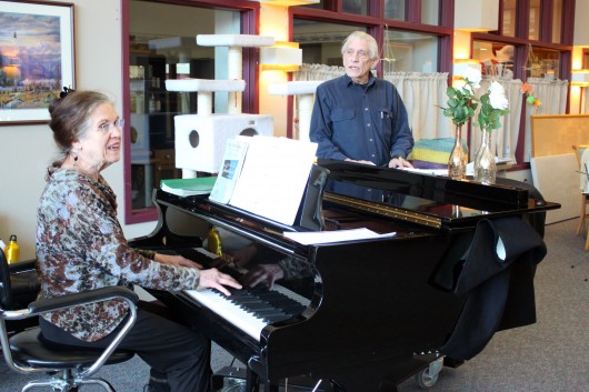 Jacque Farnsworth and Jack Brandt lead a music activity at the Juneau Pioneers’ Home. Farnsworth says she’s been singing and playing piano there since 2003. (Photo by Lisa Phu, KTOO - Juneau)