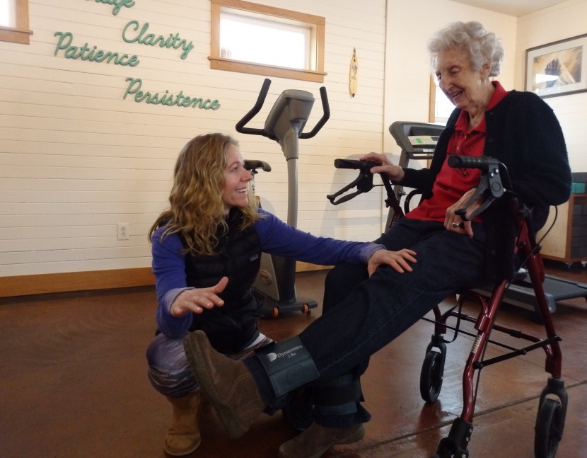 Haines physical therapist Marnie Hartman works with 92-year-old patient Marge Ward. Hartman said most of her business comes from people 65 and older. (Photo by Emily Files, KHNS - Haines)