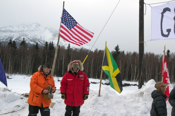 Helpers welcome mushers to Takotna checkpoint mid-day Wednesday. (Photo by Zachariah Hughes/KSKA)
