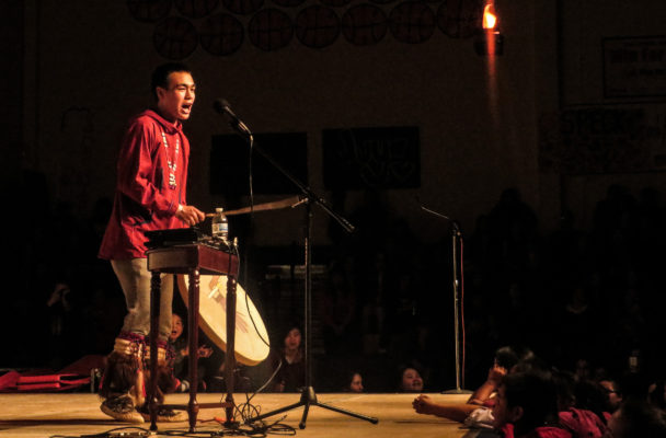 Byron Nicholai sings and drums at the 2016 Cama-i Dance Festival in Bethel. (Photo by Laura Kraegel, KNOM - Nome)
