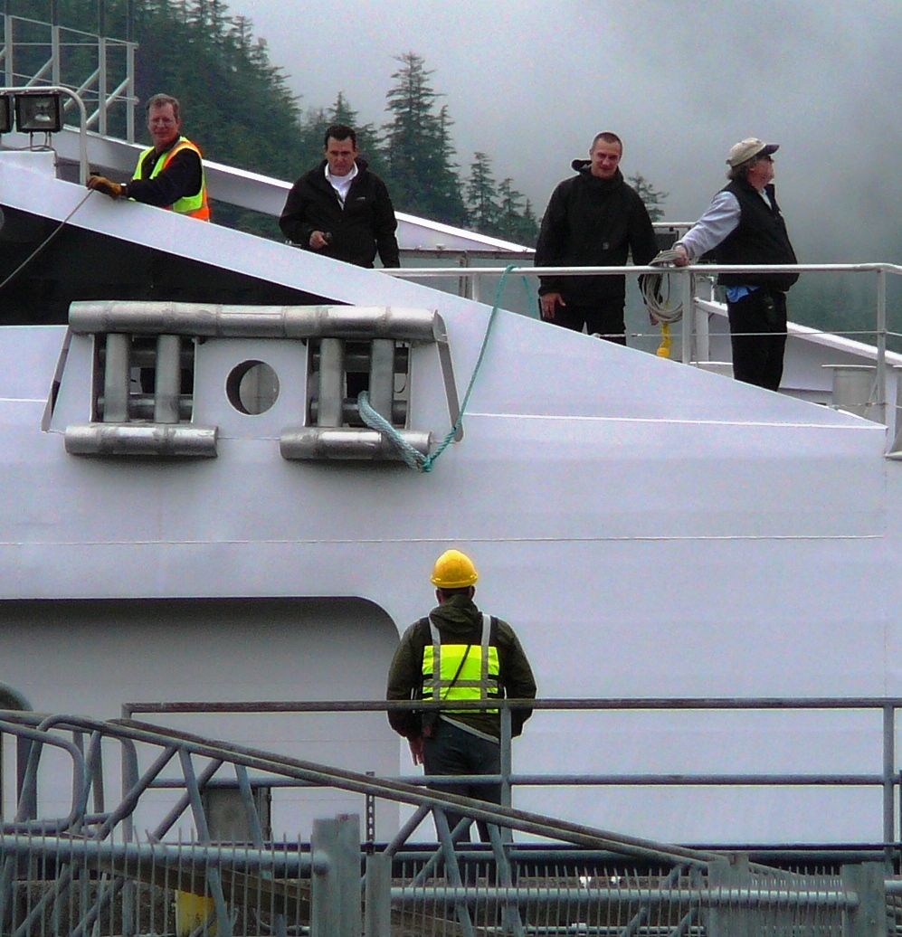 Crew members tie up the fast ferry Fairweather in Sitka. It and other marine highway ships will sail less in the next budget year. (Photo by Ed Schoenfeld, CoastAlaska)