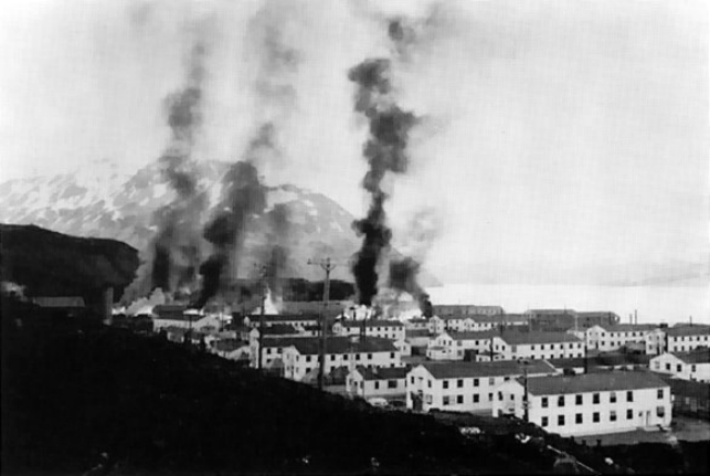 Buildings burning after the first Japanese attack on Dutch Harbor, Alaska (USA), 3 June 1942. (Photo courtesy of the U.S. Army)