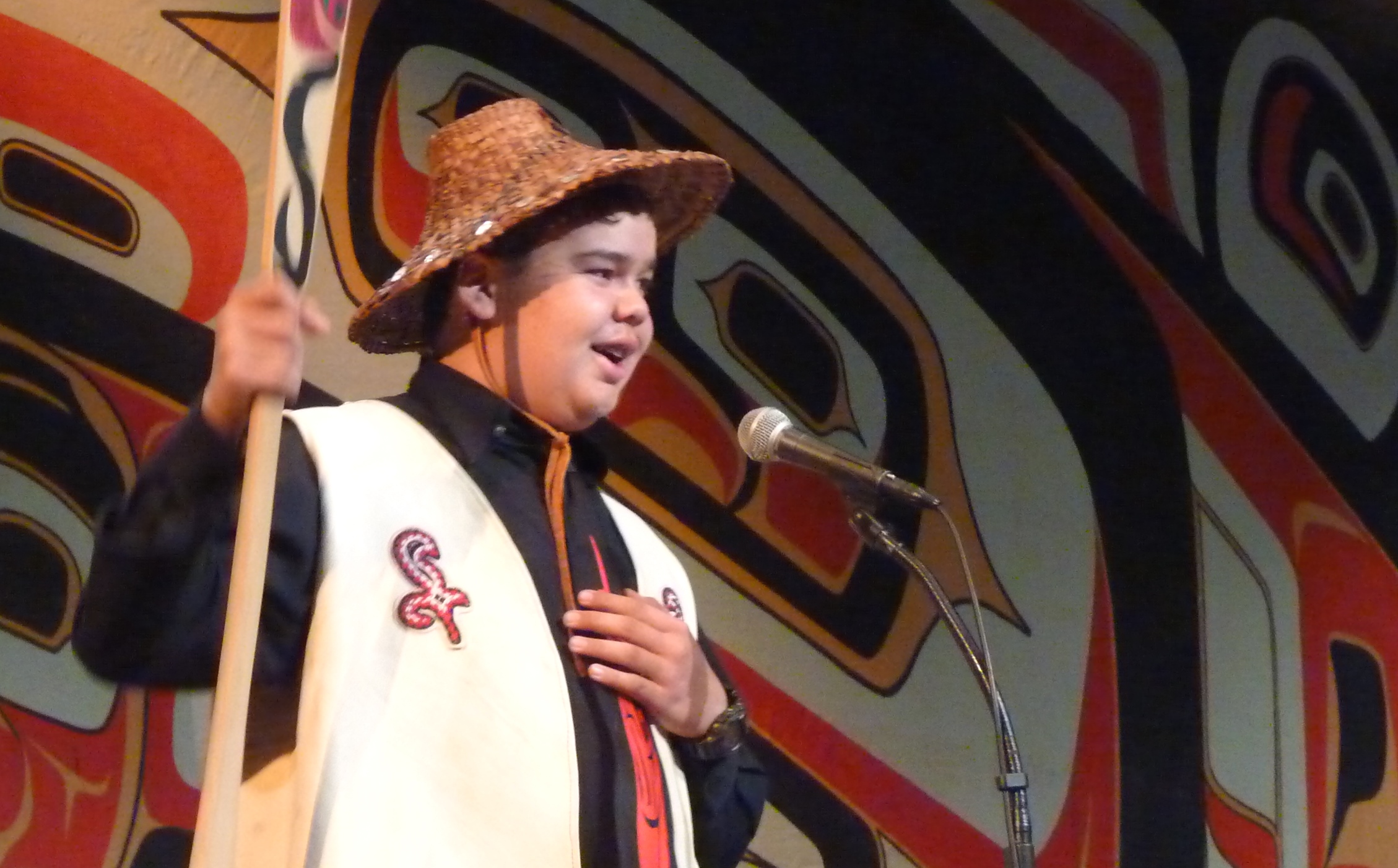 Youth Spokesman Matthew Wesley asks the Celebration audience for a Hoo-Ha cheer during the Taku Kwaan performance at Juneau’s Centennial Hall. (Photo by Ed Schoenfeld, CoastAlaska - Juneau)