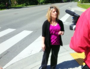Sharon Bergman talks about her son Cody’s accident at this crosswalk in 2014. Cody is now a junior in high school. He’ll make a full recovery. (Photo by Robert Woolsey - KCAW - Sitka)