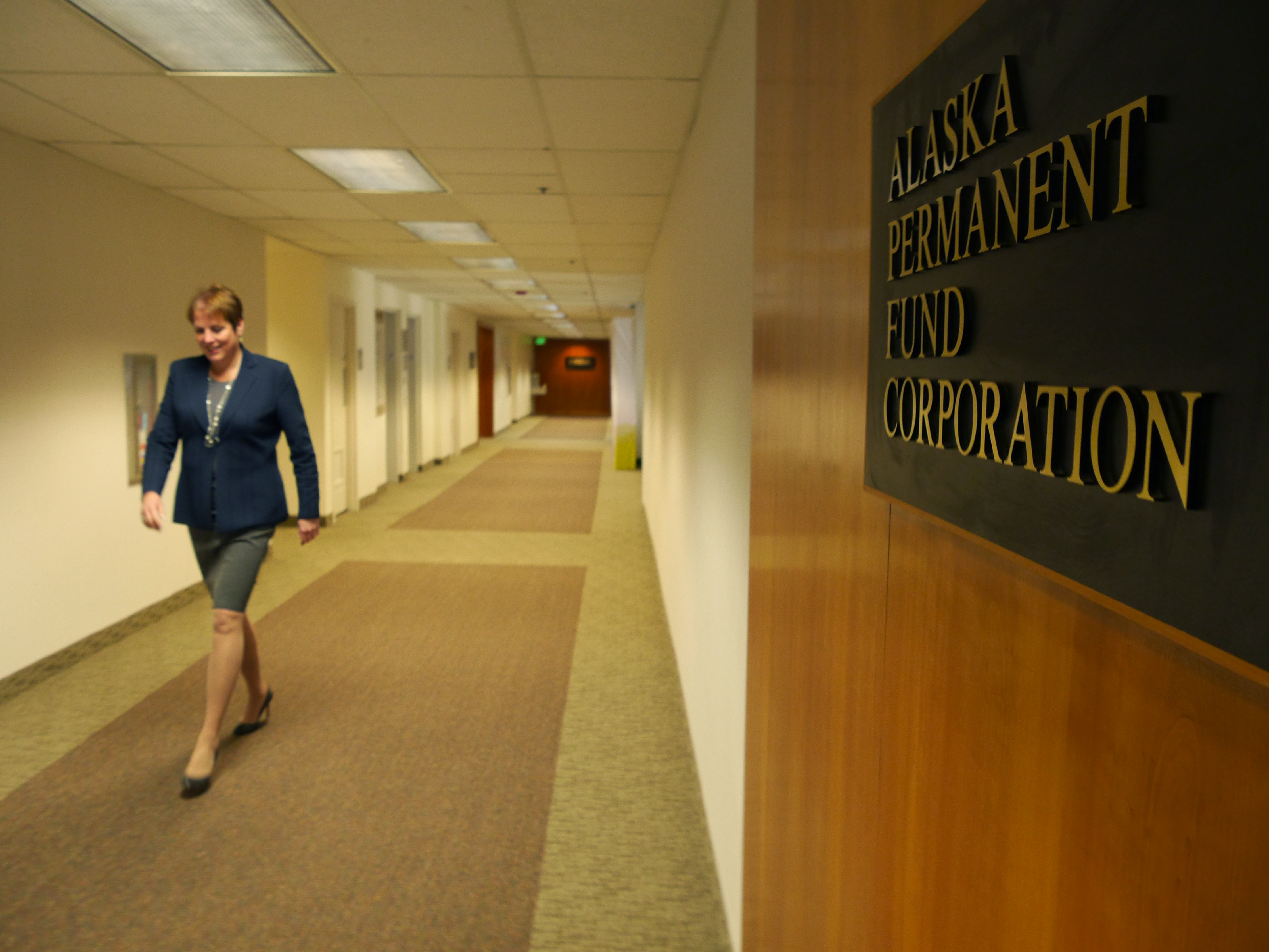 Alaska Permanent Fund Executive Director, Angela Rodell, in the hall at the corporate headquarters, March 14, 2016. (Photo by Skip Gray, 360 North)