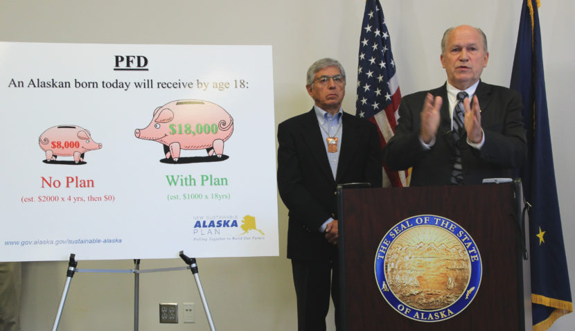Gov. Bill Walker announces line-item budget vetoes at the Atwood Building in Anchorage on Wednesday. Lt. Gov. Byron Mallott is also pictured. (Photo by Rachel Waldholz, Alaska's Energy Desk)