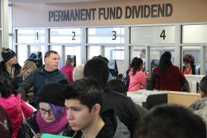 Alaskans wait in line to file their Permanent Fund dividend applications in downtown Anchorage in March 2016. Photo: Rachel Waldholz, APRN