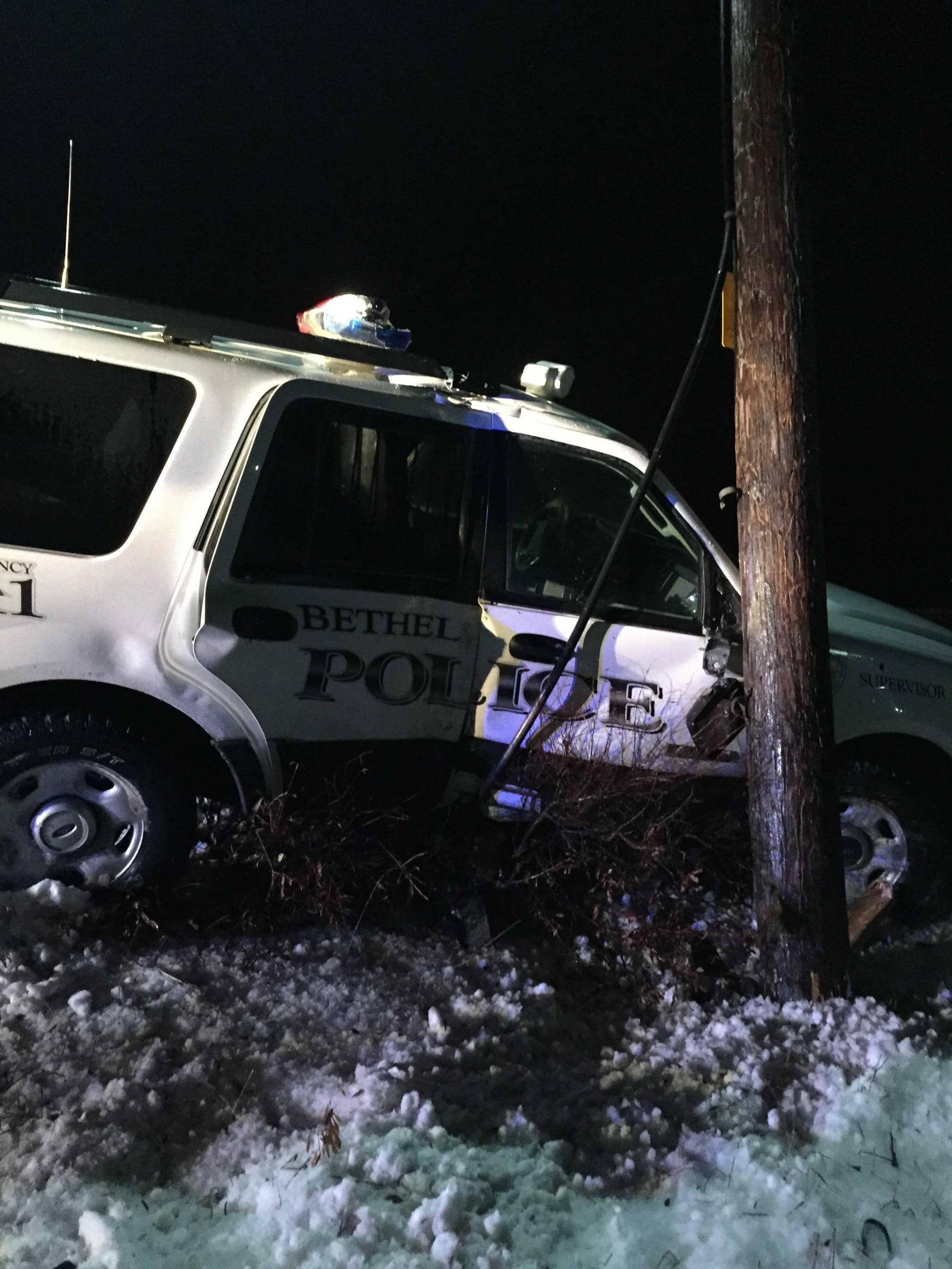 Damage from the vehicle's collision with the electrical pole (Photo courtesy of Bethel Police Department)