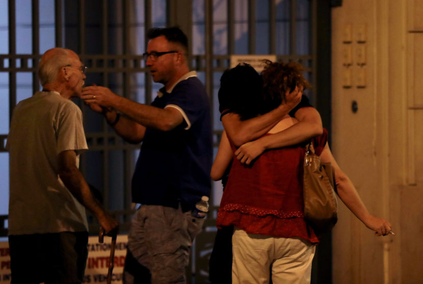 People in Nice react in the early hours of Friday morning after the attack. (Photo by Valery Hache/AFP/Getty Images)